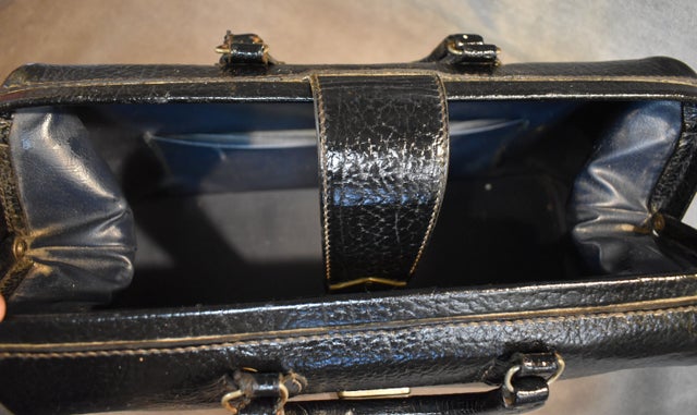 A black leather doctor's bag, circa 1911.